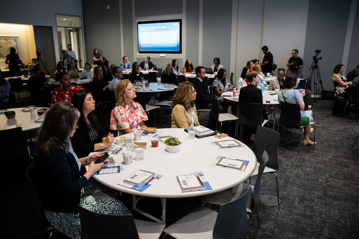 Event attendees sit at tables